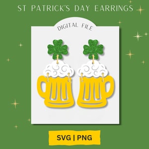 May include: Digital file of a pair of St. Patrick's Day earrings featuring a green shamrock charm and a yellow beer mug with white foam.