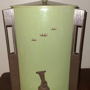 May include: A set of three ceramic mugs with a speckled, matte finish. Each mug features a different color: light blue, cream, and gray. The mugs have a simple, modern design and a comfortable handle.