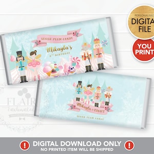 May include: Two printable chocolate bar wrappers featuring a Nutcracker and ballerina theme. The wrappers are light blue with snowflakes and feature a pink banner with the text "Sugar Plum Candy" and the name "Mikayla". One wrapper says "Mikayla's 8th Birthday" and the other says "Mikayla is Eight".