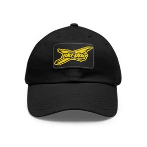 May include: Black baseball cap featuring a yellow and black "ski-doo TEAM" logo patch. The cap has a curved brim and an adjustable strap at the back. The hat is made of a soft, durable fabric.