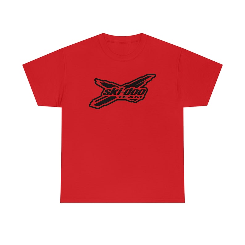 May include: Red t-shirt with a black Ski-Doo Team logo. The logo features a stylised ski-doo with the words "Ski-Doo Team" underneath.