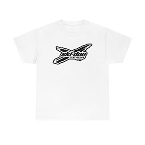 May include: White t-shirt featuring a black Ski-Doo Team logo. The logo depicts a stylised ski design with the words "Ski-Doo Team" in a black box.