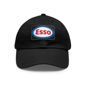 May include: Black baseball cap with a white and blue oval patch featuring the word "Esso" in red letters.