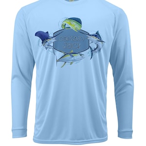May include: Light blue long-sleeved shirt with a graphic of four fish and the text "captain jack" in a gray shield.