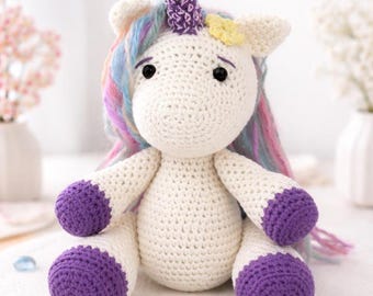 Handmade crocheted unicorn plush with a rainbow mane, bedroom decoration