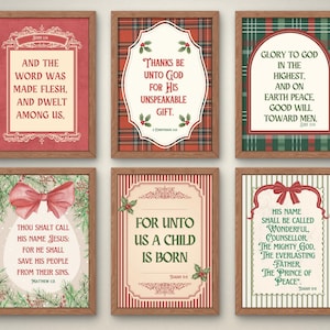 May include: Six framed Christmas-themed art prints with religious quotes. Each print features a different design, including text, decorative borders, and festive elements like bows and holly. The frames are a warm brown color.