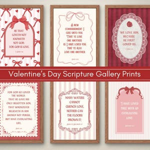 May include: Six framed Valentine's Day scripture prints with romantic quotes in red and pink. Each print has a unique design, including bows, hearts, and decorative borders. The text "Valentine's Day Scripture Gallery Prints" is displayed on a red banner.