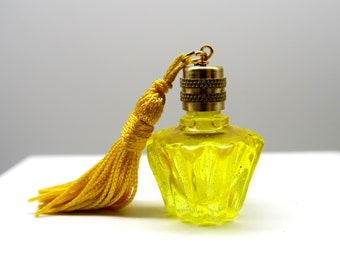 Vintage leeg parfumminiatuur in gele stervorm met pompon - 4 cm hoog - Geleverd in zakje