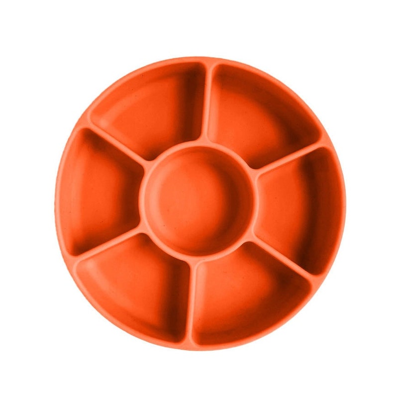 May include: Orange silicone divided plate with six sections. The plate is designed for feeding babies and toddlers.