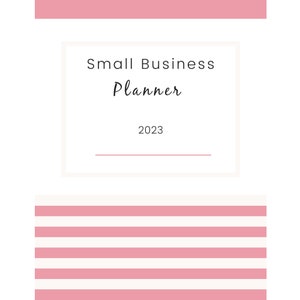 May include: A white and pink small business planner for 2023. The cover features the text "Small Business Planner" in a handwritten font, with the year 2023 below. Pink horizontal stripes are at the bottom.