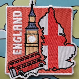 May include: Embroidered patch depicting the flag of England, a red double-decker bus, and Big Ben. The word "ENGLAND" is vertically stitched in white. The patch is bordered in white and has a red background.