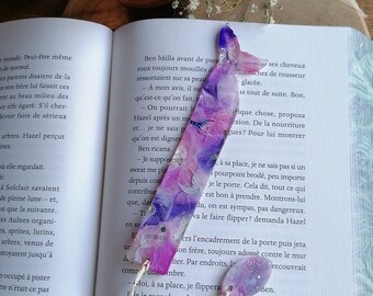 Handmade epoxy resin bookmark on the theme of mermaids.
