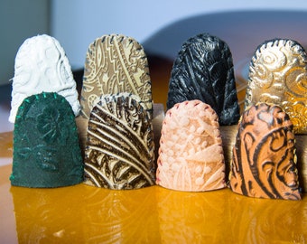 Tooled leather thimbles