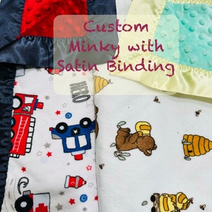 May include: Two custom minky baby blankets with satin binding. One blanket features a red, white, and blue fire truck, police car, and ambulance pattern. The other blanket features a brown bear with a honeycomb pattern.