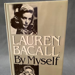 May include: A book cover featuring a black and white photograph of Lauren Bacall. The title of the book is "Lauren Bacall By Myself".