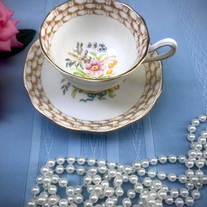 Vintage Royal Albert Footed  Floral Teacup and Saucer Set