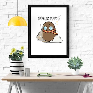 May include: A black framed print with a white background and a cartoon potato wearing glasses and a scarf. The text "Expecto Potato!" is written in black above the potato.