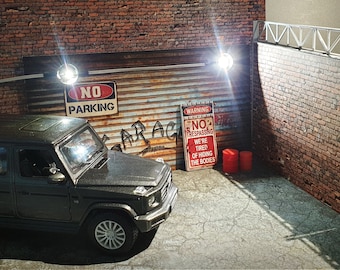 Puede incluir: Un SUV negro con un letrero de "No Parking" y un letrero de "Warning No Trespassing" en un garaje de ladrillo.