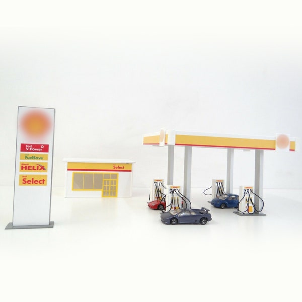 Diorama-Tankstelle im Maßstab 1:43. Druckgussautomodelle zeigen ein Miniaturmodell einer Tankstelle im Maßstab 1:43, einen Diorama-Modellbausatz
