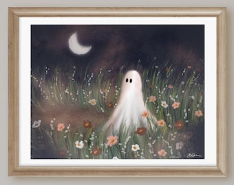 May include: Framed art print of a white ghost with black eyes in a field of wildflowers under a crescent moon. The flowers are pink, orange, and white, set against a dark night sky. The frame is light brown.