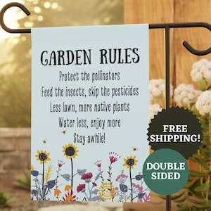 May include: A light blue garden flag with the text "GARDEN RULES" and a list of gardening tips. The flag features a floral design with sunflowers and bees. The flag is double-sided.