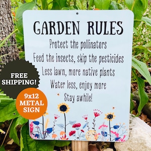 May include: A white metal sign with the text "GARDEN RULES" and a list of rules for gardening, including "Protect the pollinators", "Feed the insects, skip the pesticides", "Less lawn, more native plants", "Water less, enjoy more", and "Stay awhile!" The sign is decorated with colorful flowers and a bee. The sign is 9x12 inches and is made of metal.