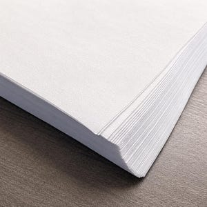 May include: A stack of crisp, white rectangular sheets of paper with a subtle, fine-grained texture. The sheets are neatly aligned, showing the layered edges of the paper stack from an angled perspective, highlighting the clean, bright white surface.