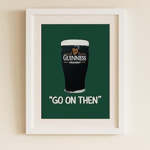 May include: A framed print featuring a pint of Guinness with a white head, set against a dark green background. The Guinness logo is visible on the glass. Below the glass, the text "GO ON THEN" is displayed in white.