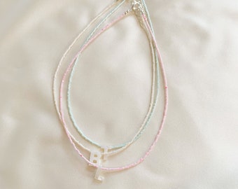 Custom letter initial bead necklace with tiny dyed pastel shell beads in blue, cream, or pink - silver plated or sterling silver clasp