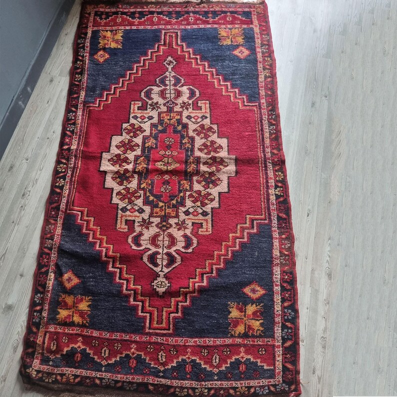 Historical 1850s rug with a classic Turkish design, ideal for collectors of vintage textiles.