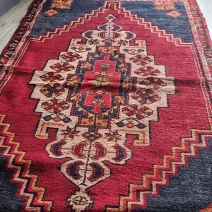Antique Ottoman rug from the 1850s, handwoven with natural wool and plant-based dyes.