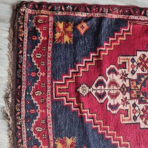 Vintage Oriental rug, a rare 19th-century piece with symbolic geometric and floral designs.