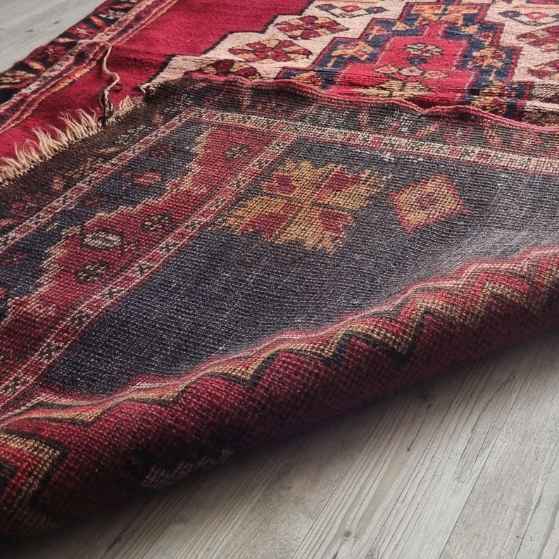 Handcrafted antique Turkish rug, a unique and irreplaceable family heirloom.