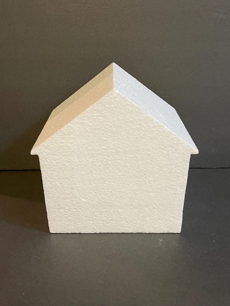 May include: White polystyrene house shape for crafting projects. The house is blank and ready to be decorated.