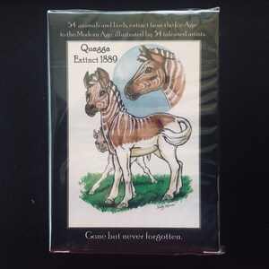 May include: A vintage illustration of a Quagga, an extinct zebra species, with brown and white stripes. The illustration is set against a green grassy background and includes the text "Quagga Extinct 1889" and "Gone but never forgotten."