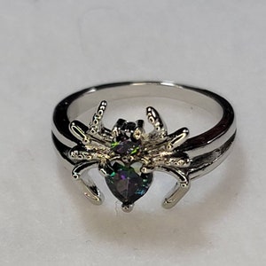 A very cool silver spider graces us with a mystic topaz. CLOSEOUT