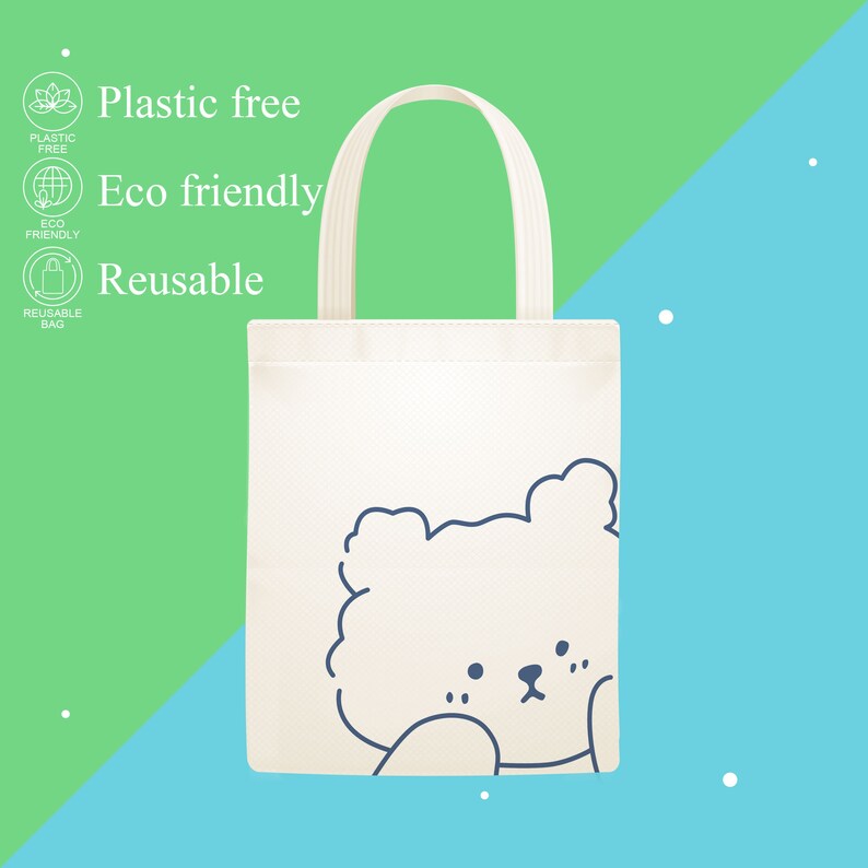 May include: White tote bag with a blue outline of a cartoon bear's face. The bag has the text "Plastic free", "Eco friendly", and "Reusable" printed on it.