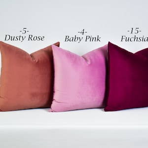 May include: Three velvet pillow covers in dusty rose, baby pink, and fuchsia. The pillow covers are arranged in a row from left to right.