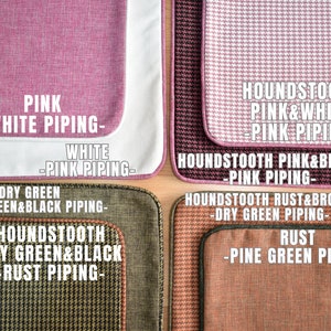 May include: A close-up of four fabric swatches with different patterns and colors. The swatches include pink with white piping, houndstooth pink and white with pink piping, dry green with dry green and black piping, and houndstooth dry green and black with rust piping. Text labels identify each swatch.