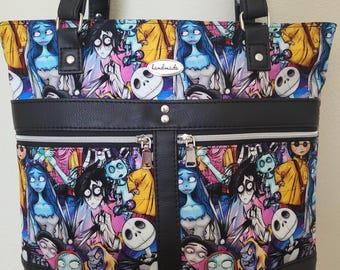 Tote/travel bag with Tim Burton characters. Pockets front, back and inside (for cell phones), padded computer pocket, key fob. 13 x 12 x 4"