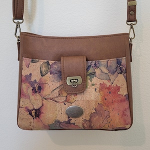 Printed cork, soft tan faux leather, and lots of pockets make this classy mid-size purse/shoulder-bag/crossbody a winner. 8 x 10 x 4.