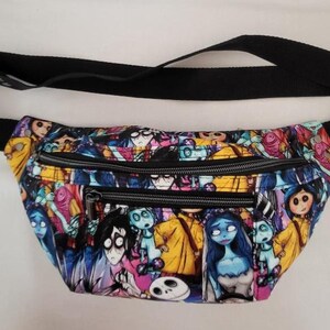 May include: A black fanny pack with a colorful print of characters from the movie "Corpse Bride". The pack has two zippered compartments.