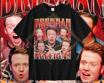 May include: Black t-shirt with a vintage-style graphic featuring a group of people with the text "Brennan & Mulligan" in white letters.