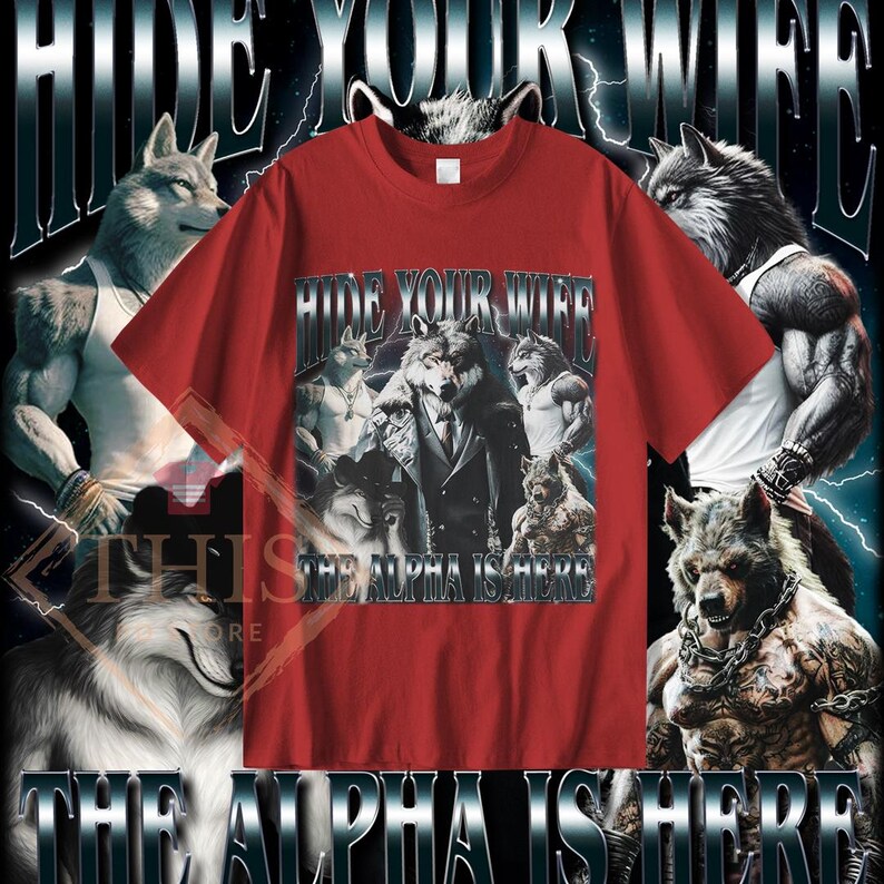 May include: Red t-shirt with a graphic print of a wolf wearing a suit and the text "Hide Your Wife The Alpha Is Here".