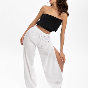 These versatile white slit pants are perfect for activities like yoga, dance, breathable sensation that stays with you throughout the day.