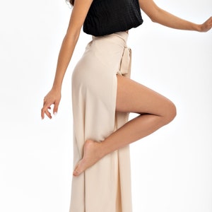 Boho Flared Yoga Pants for Women - Perfect for Yoga, Dance, and Relaxation. These beige harem-style pants offer ultimate comfort and a touch of bohemian style. An eco-friendly choice for your wardrobe and a thoughtful yoga gift.