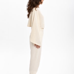 Pre-washed cotton crop blouse to eliminate fabric pulling issues, perfect for everyday wear.