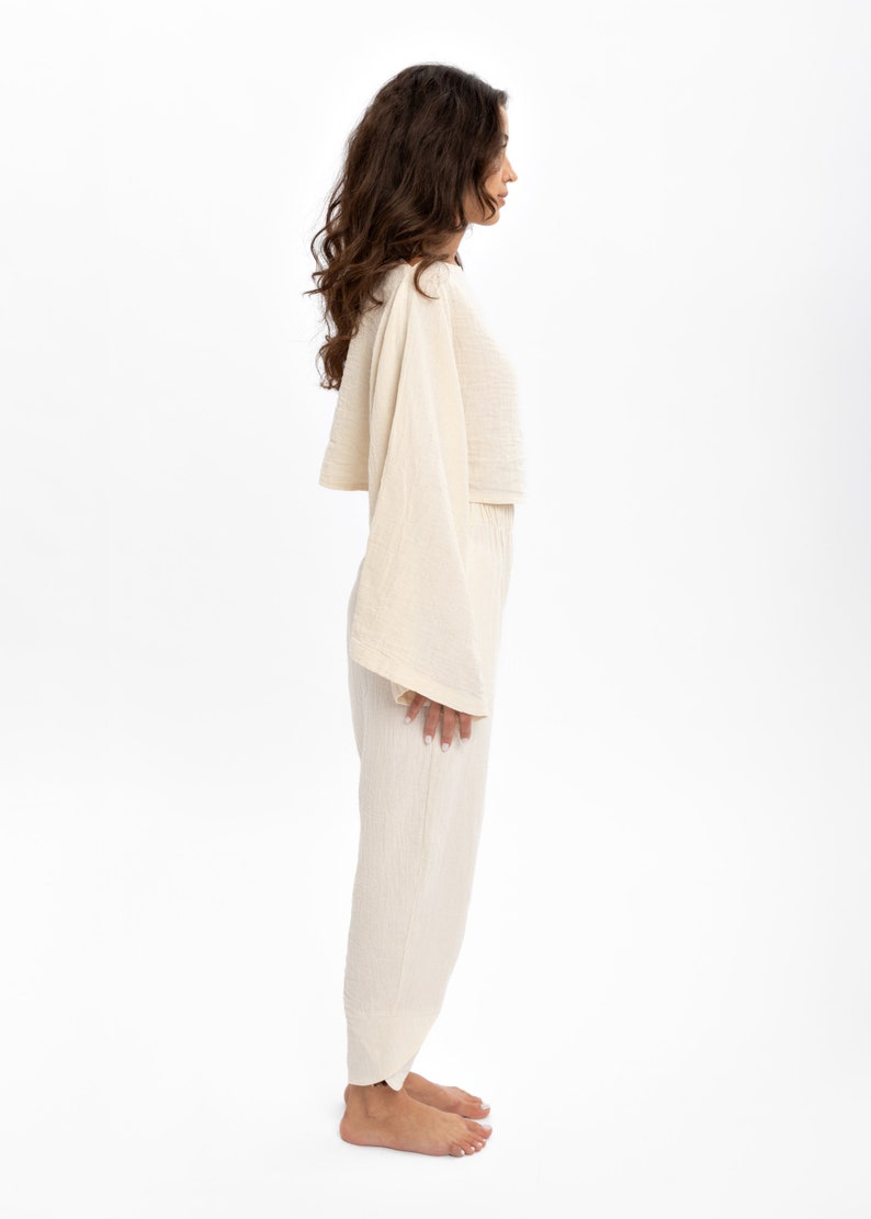 Pre-washed cotton crop blouse to eliminate fabric pulling issues, perfect for everyday wear.