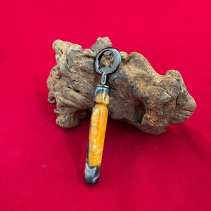 Bottle Opener with distinctive mixed resin colors.