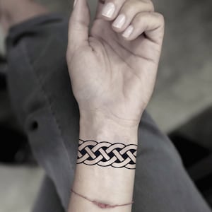 Celtic knot store finger tattoo